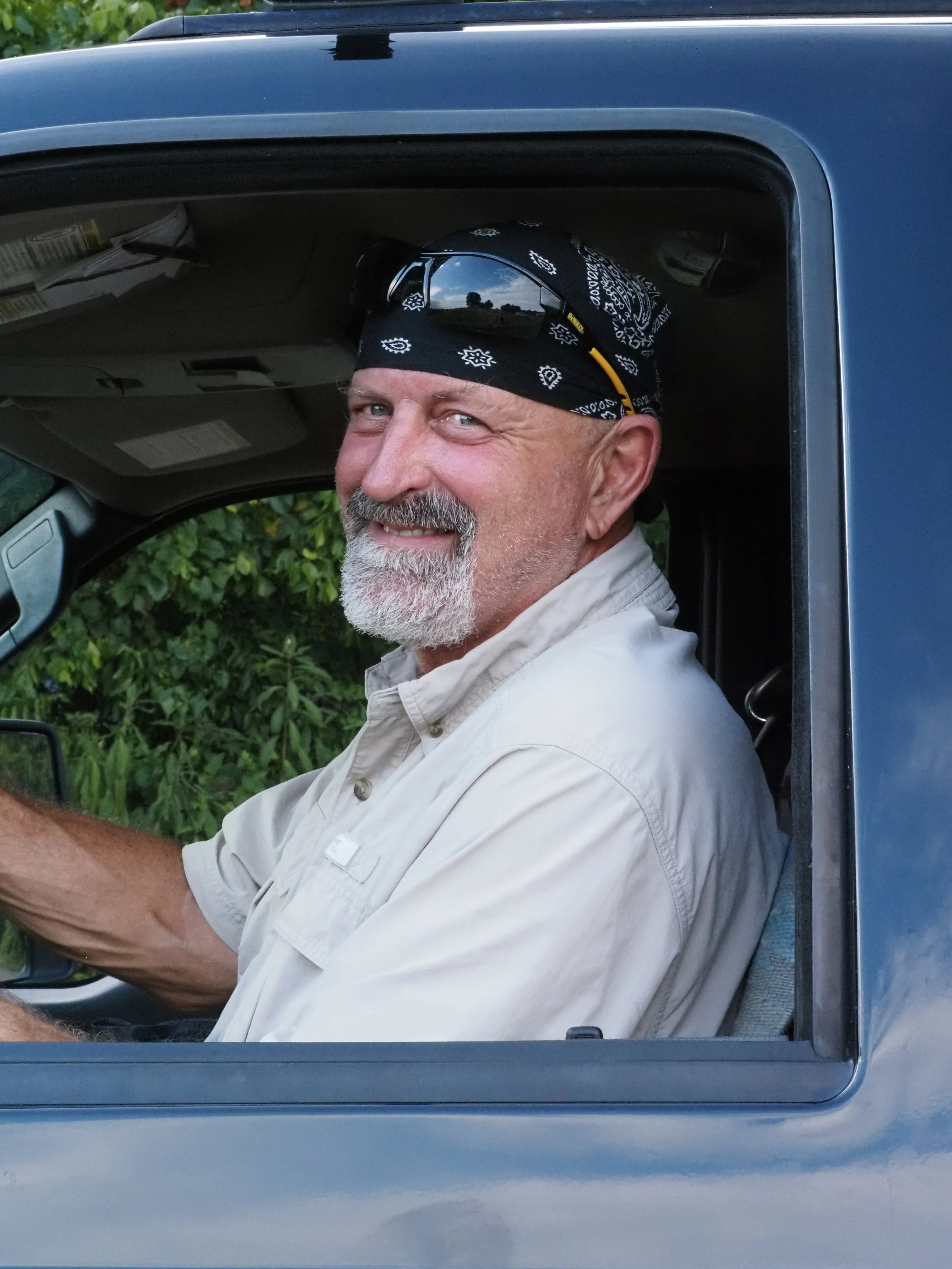 The committed team of Haulin' Assets LLC, showcasing their hands-on approach to eco-friendly junk removal in Charlottesville.